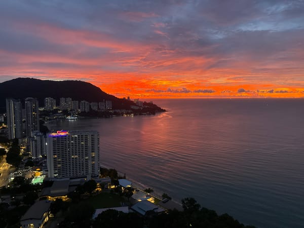 Vivid coastal sunset over George Town from above