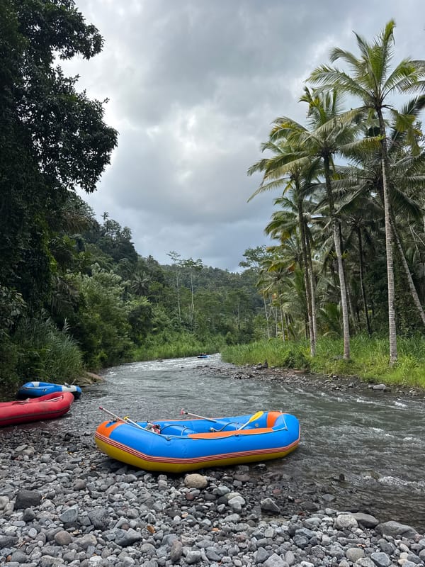 River rafting groups navigate shallow waters in Sidemen Indonesia