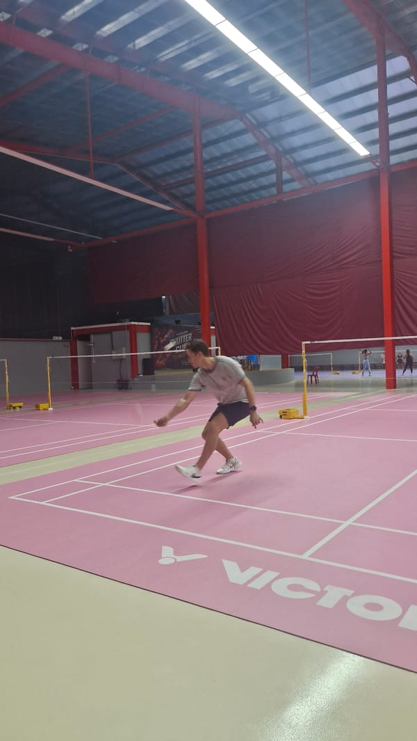 Badminton in session on a pink Victor court in Ko Samui