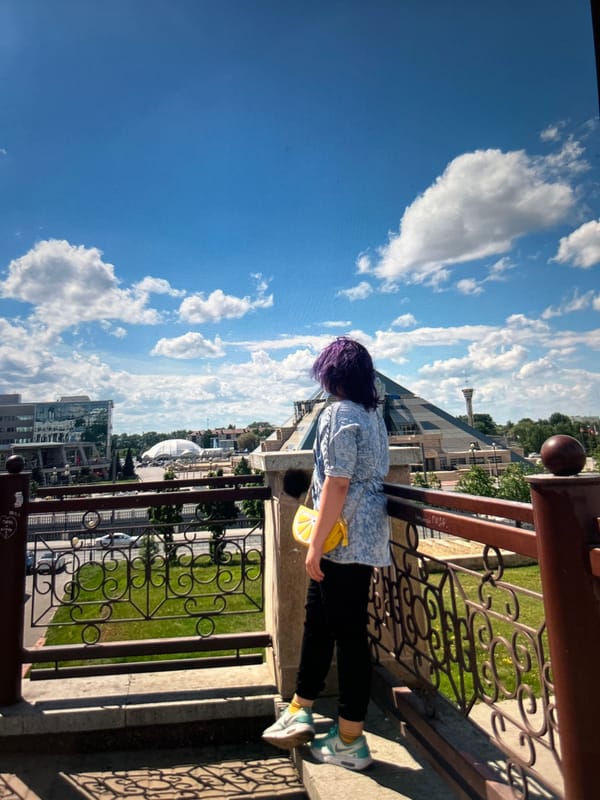 Sunny city outing with a victory pose and purple hair