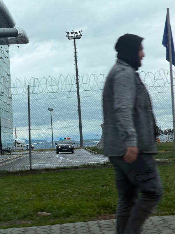 Person observed near security fence with police presence in Tbilisi