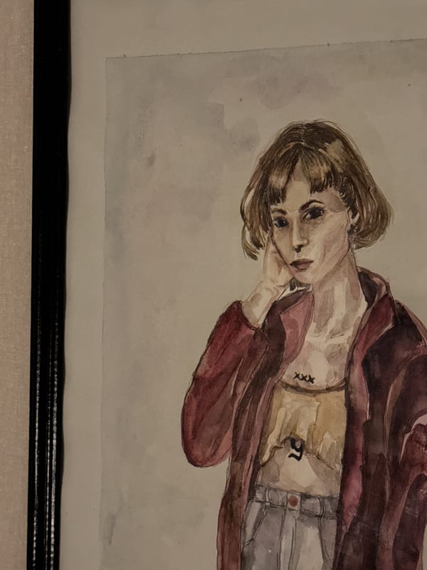 Framed watercolor portrait of tattooed figure documented on indoor wall