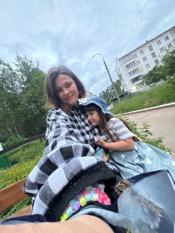 Mother, daughter spend afternoon together in urban neighborhood
