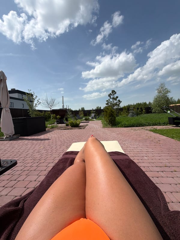 Resident sunbathes on patio in Ryazan during morning hours