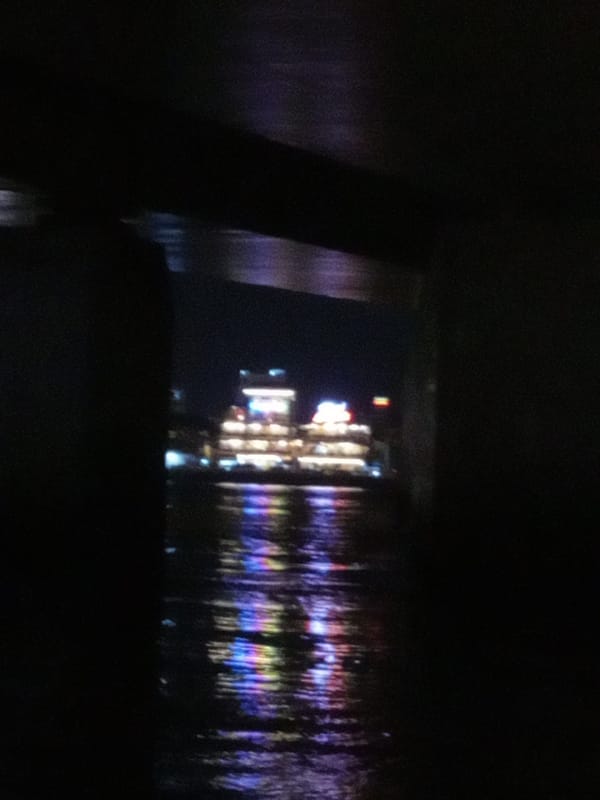 Nighttime waterfront building photographed in Trang Vietnam heritage area