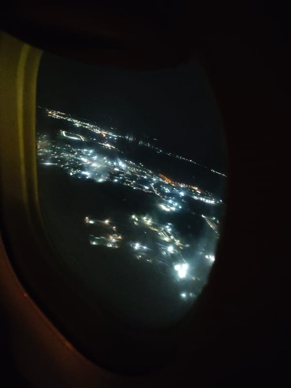Night aerial view of Marusino city lights captured from aircraft