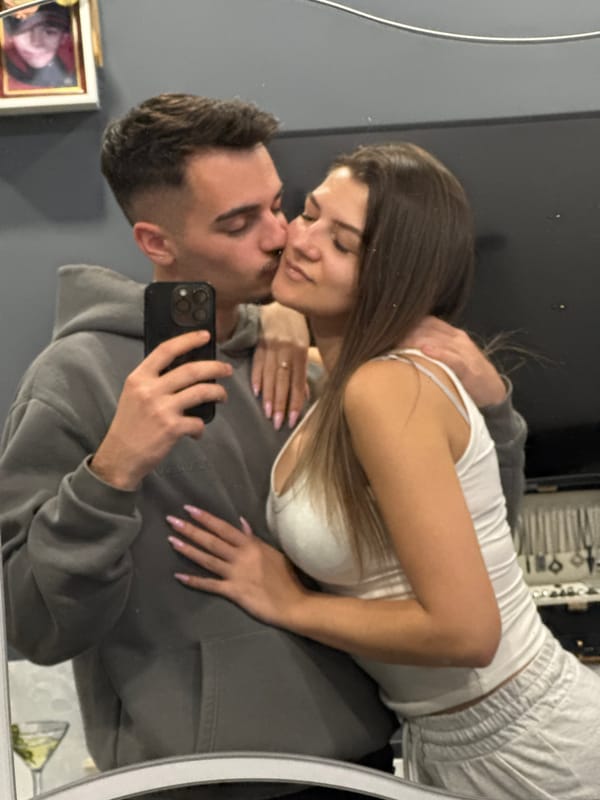 Woman takes mirror selfie in Sofia living room