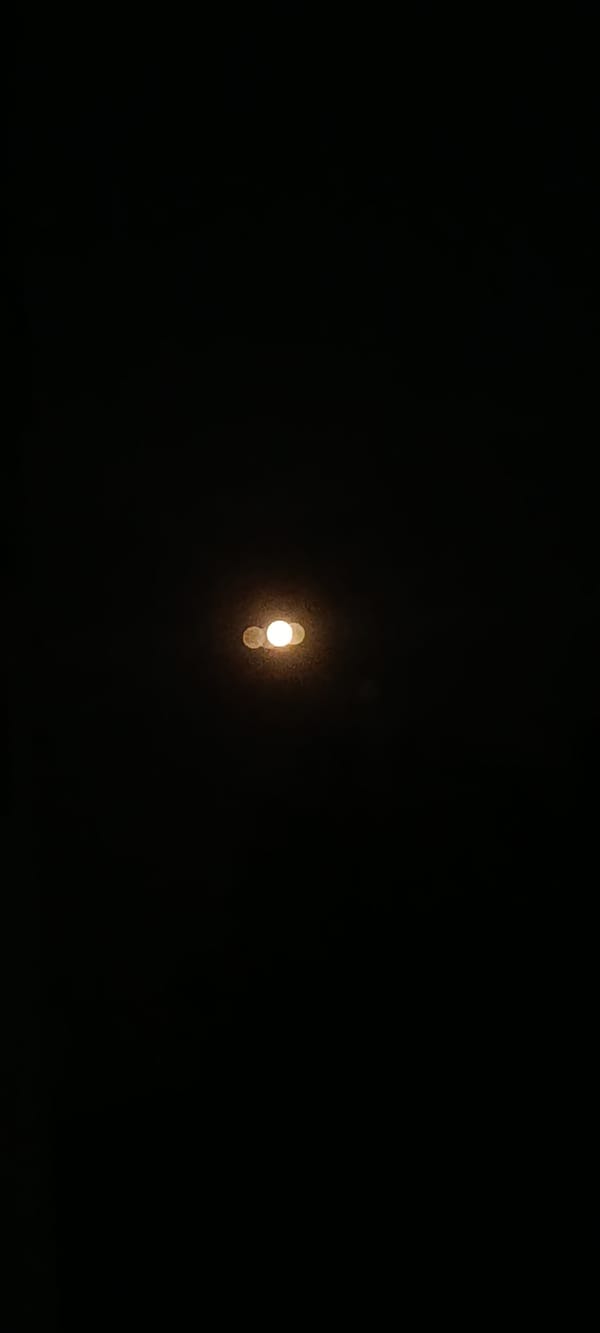 Close-up nighttime shots of street lights glowing against dark skies