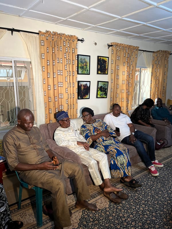Indoor gathering in Bukuru living room