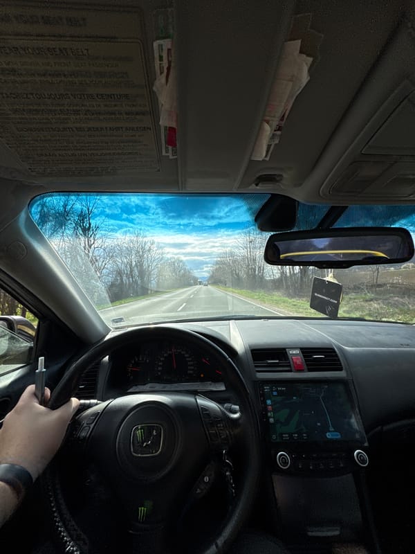Driver travels road in Bogatovo with Monster Energy steering wheel