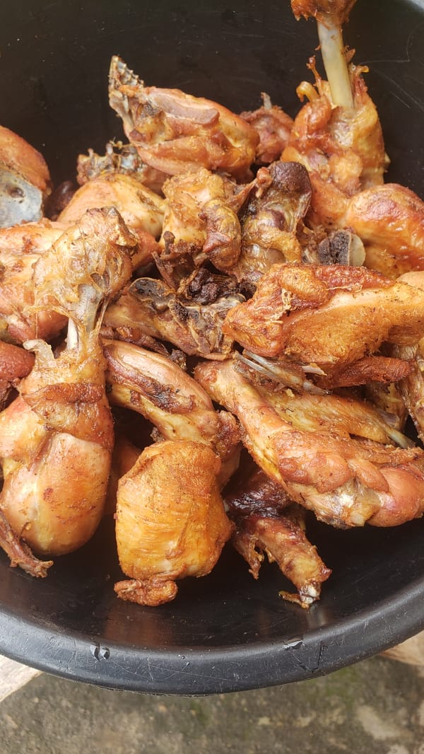 Big outdoor cook-up in Sabon Tasha: fire, rice, and fried chicken