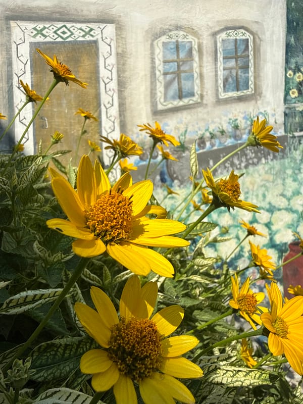Flowers, succulents, and garden curiosities at an eclectic outdoor space