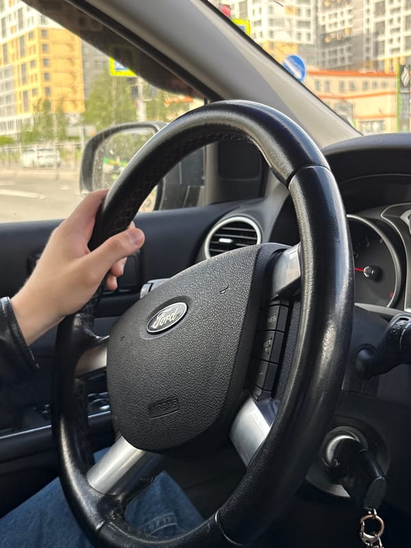 Driver operates Ford vehicle through Saint Petersburg streets