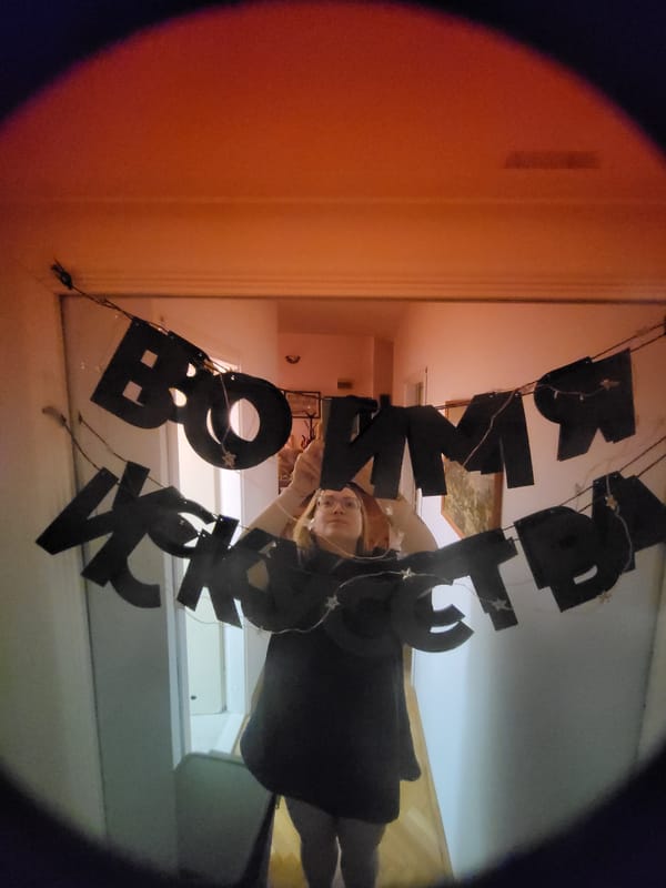 Person documented in red-lit room with dog, plants in Budva