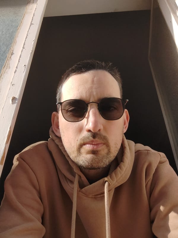 Man in sunglasses observed at window in Tel Aviv