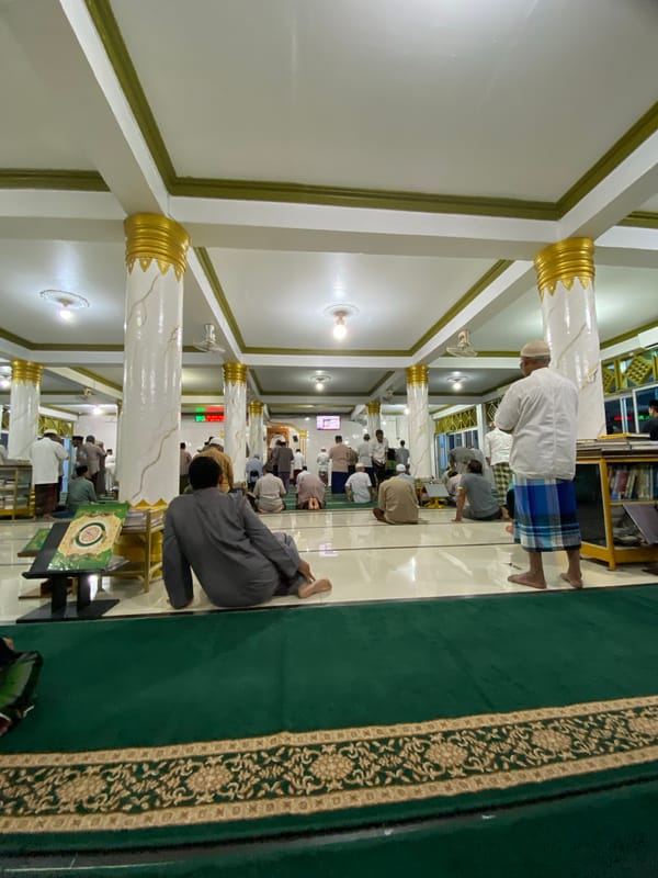Midday prayers at a mosque in Lhokseumawe, Indonesia