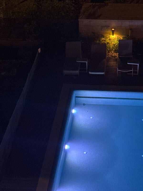 Blue-lit pool observed in Tel Aviv nighttime setting