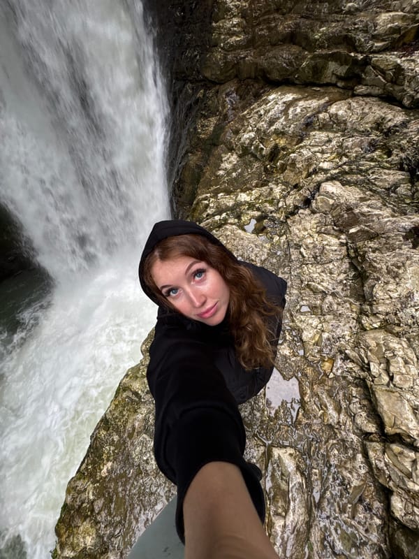 Tourist photographs waterfall and caged bears in Tsabal, Abkhazia