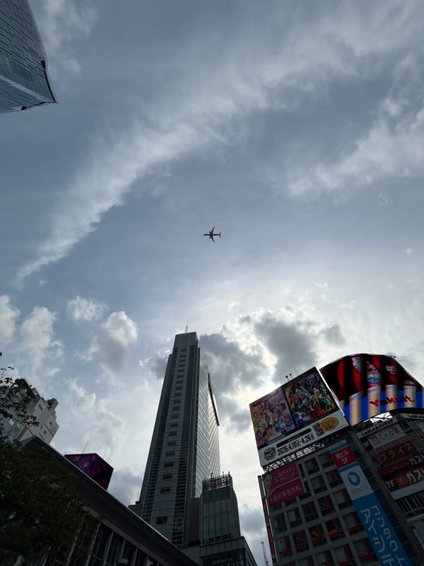 Aircraft spotted over Shibuya skyline during morning hours