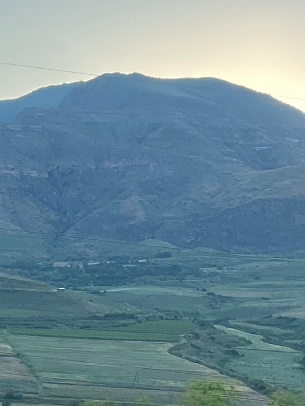 Rural road and mountain scenery near Arpi, Armenia