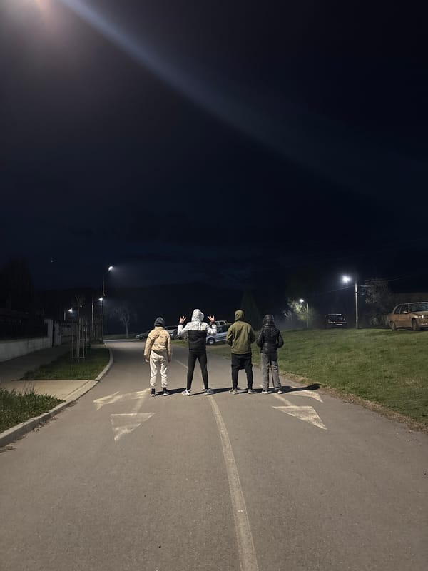 Four people stand on marked road in Zlatitsa, Bulgaria