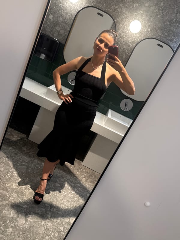 Woman Takes Selfie in Tivat Public Restroom
