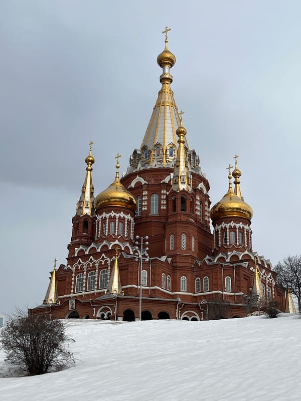Woman takes selfies near St. Michael's Cathedral in Izhevsk