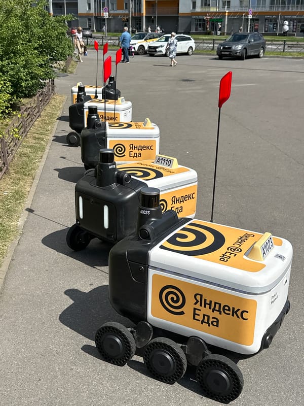 Yandex Food delivery robots parked in a row, Murino