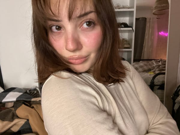 Woman takes evening selfies in bedroom in Schiltigheim