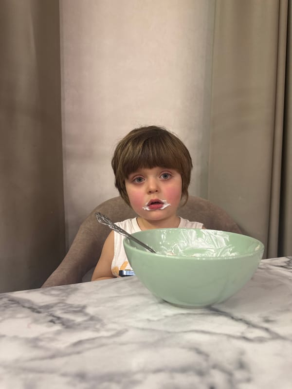 Child enjoys messy cereal meal in Khimki