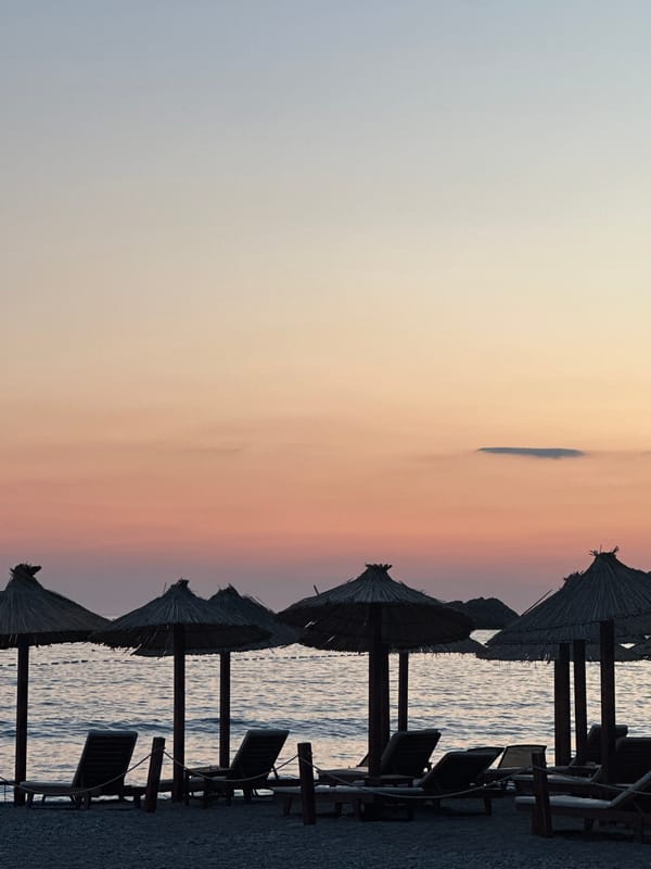 Dusk settles over a pebble beach in Mirište, Montenegro