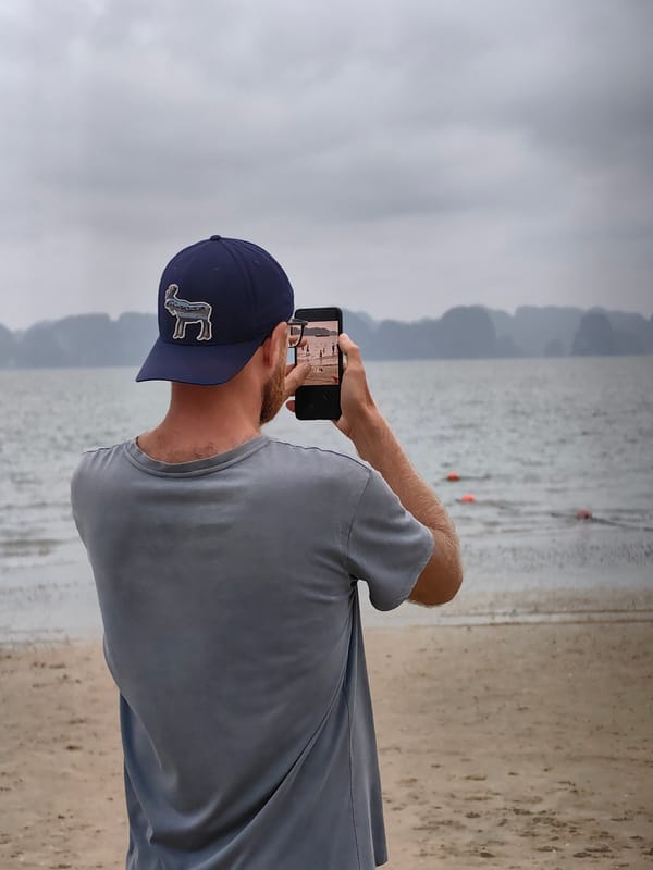 Tourists enjoy overcast beach day at Vietnam's Ha Long Bay