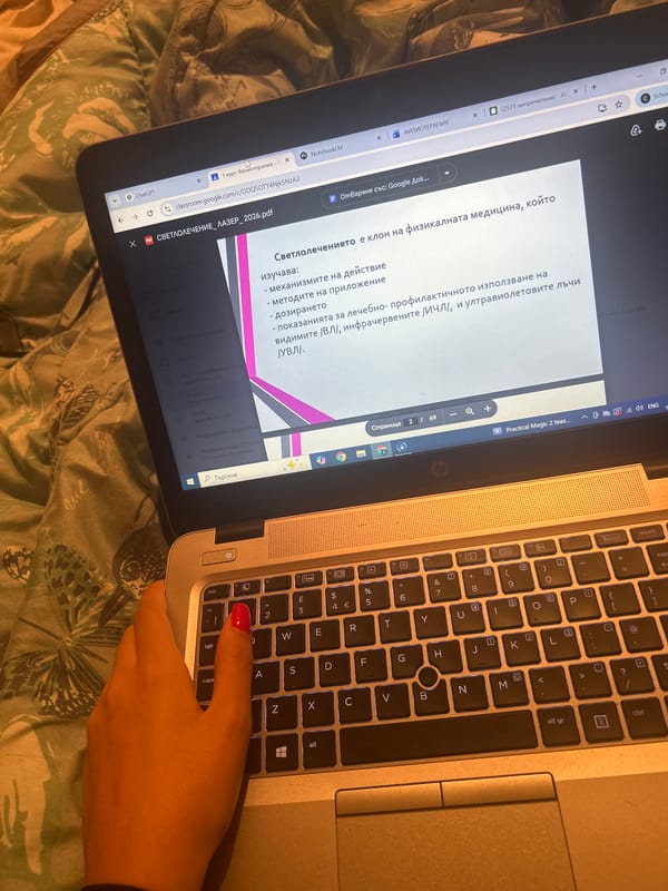 Person works on Bulgarian medical documents while drinking beverage