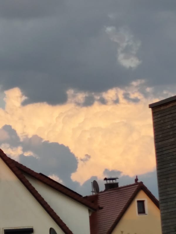 Sunset clouds roll over rooftops in Dillingen an der Donau