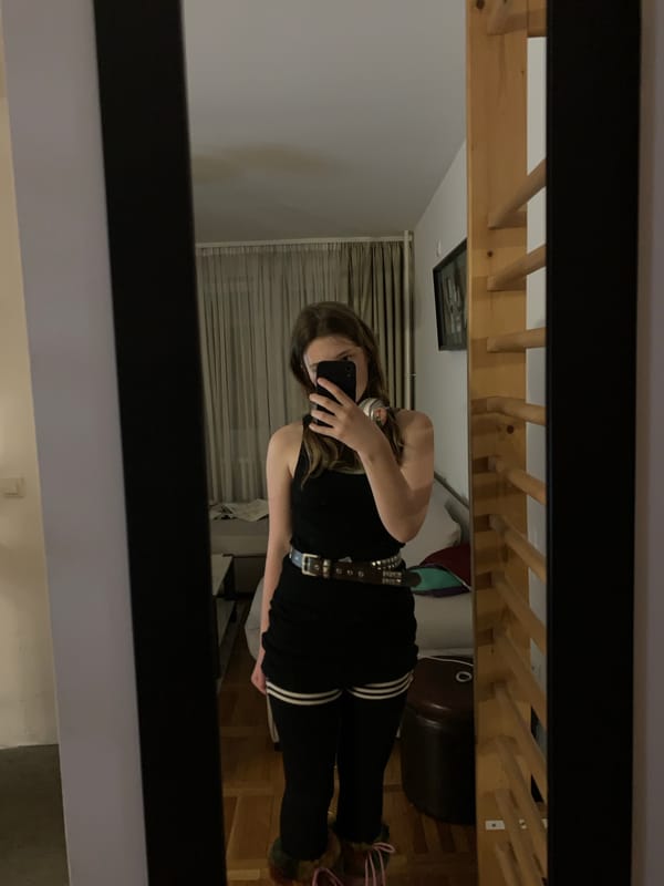 Woman takes mirror selfies in Belgrade bedroom