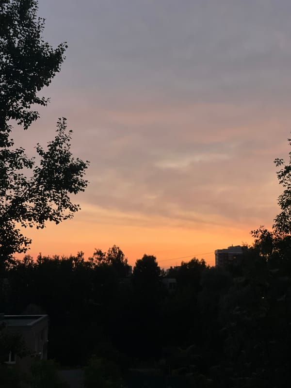 Saint Petersburg's summer sky fading through orange and purple