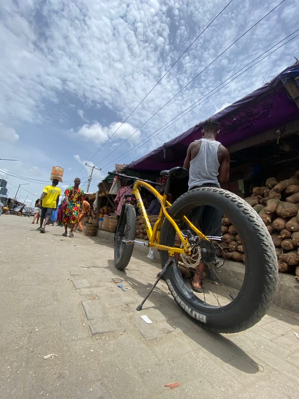 Lagos street vendors sell fresh produce at roadside markets