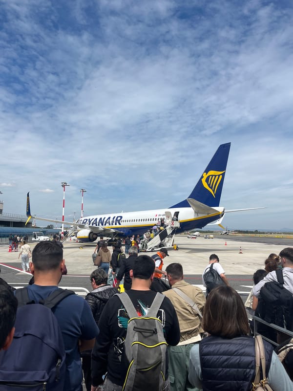 Ryanair passengers board crowded Rome flight, depart over snowy terrain