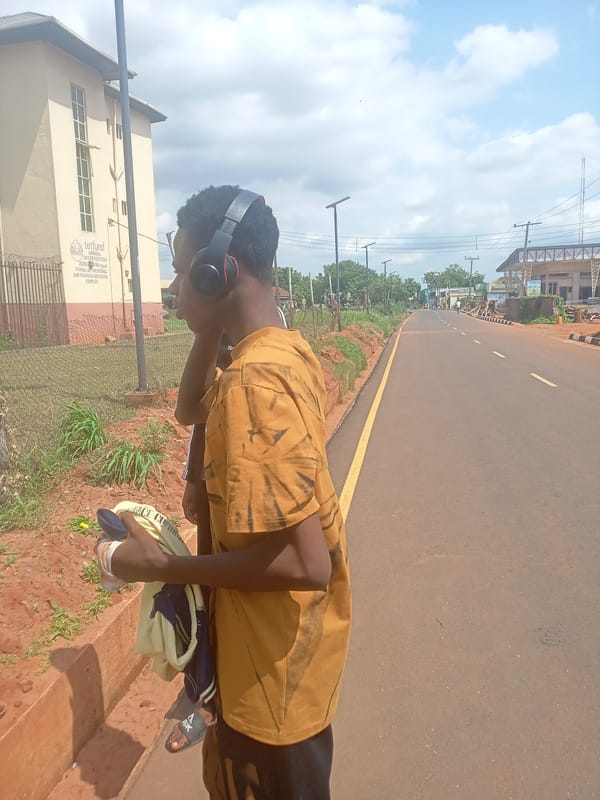 Students gather around Nsugbe, Nigeria during afternoon hours