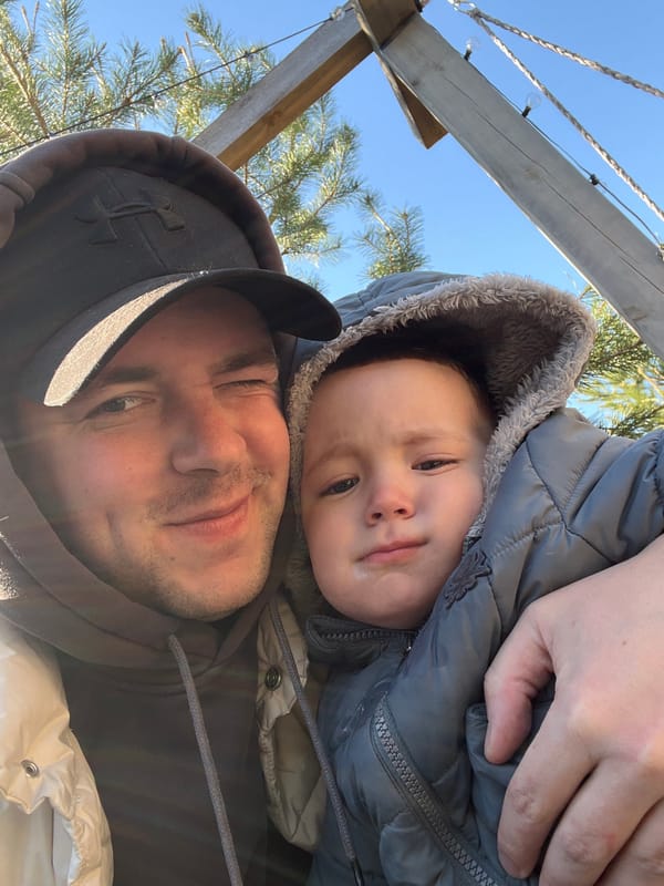 Father and child share quiet Sunday morning in Litvinovo