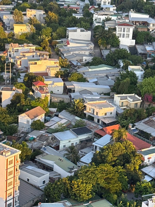 Nha Trang at sunset, city and mountains from above
