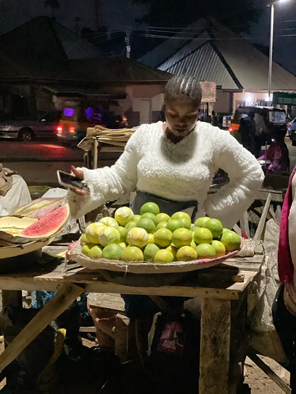 Soccer on a dirt pitch and street food after dark in Jos