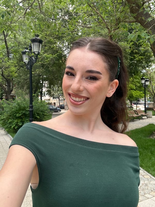 Woman photographed in green top around Plovdiv parks, car