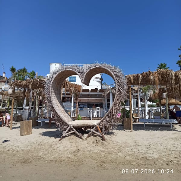 Summer beach day in full swing along the Trani coastline.