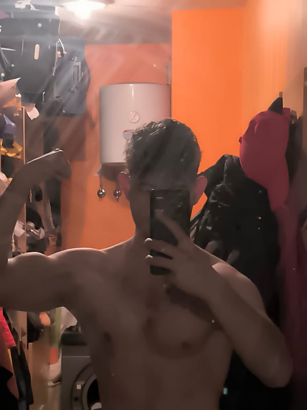Man takes multiple mirror selfies in Sofia bathroom