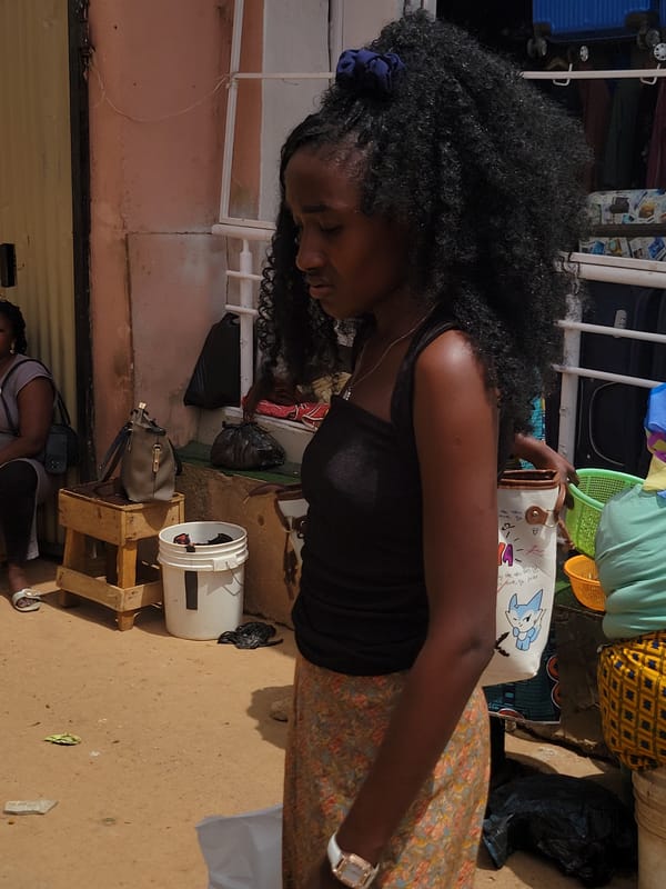 Women shop at outdoor market in Jos, Nigeria