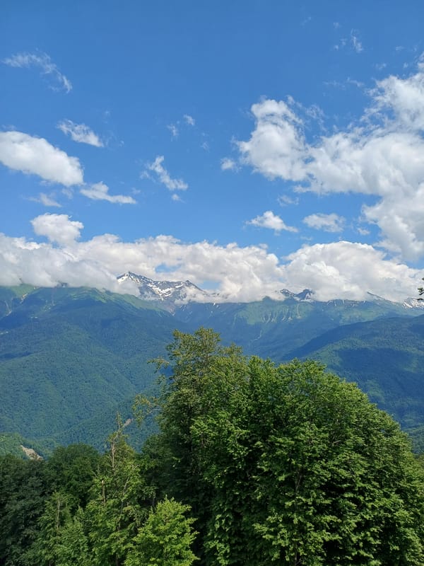 Snow-capped peaks and misty cable cars at high altitude