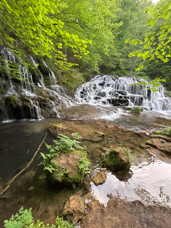 Waterfall flows over mossy rocks in Stoilovo, Bulgaria