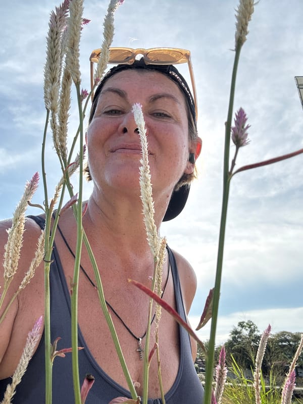 Person photographed resting in flower field in Thailand