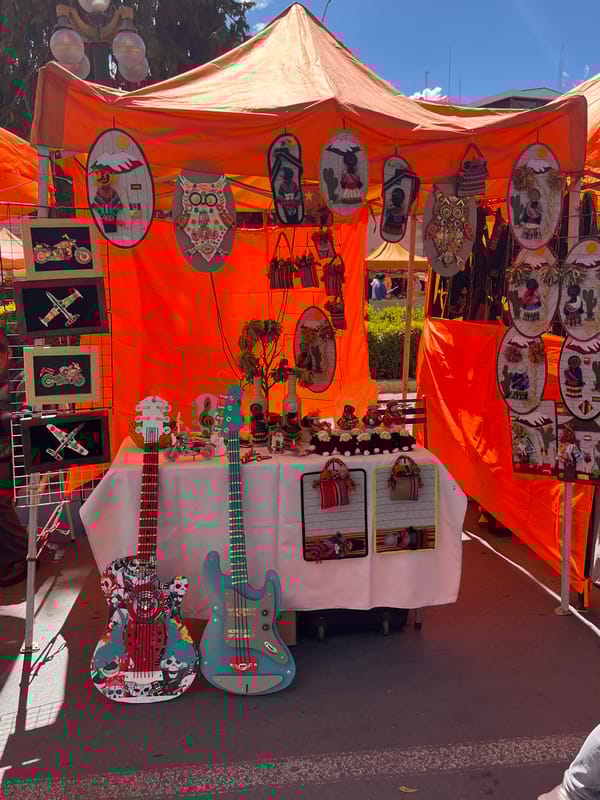 Street vendors and shoppers active in La Paz market district